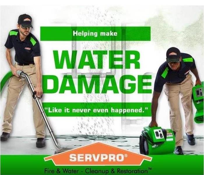 SERVPRO Technicians vacuuming water flood