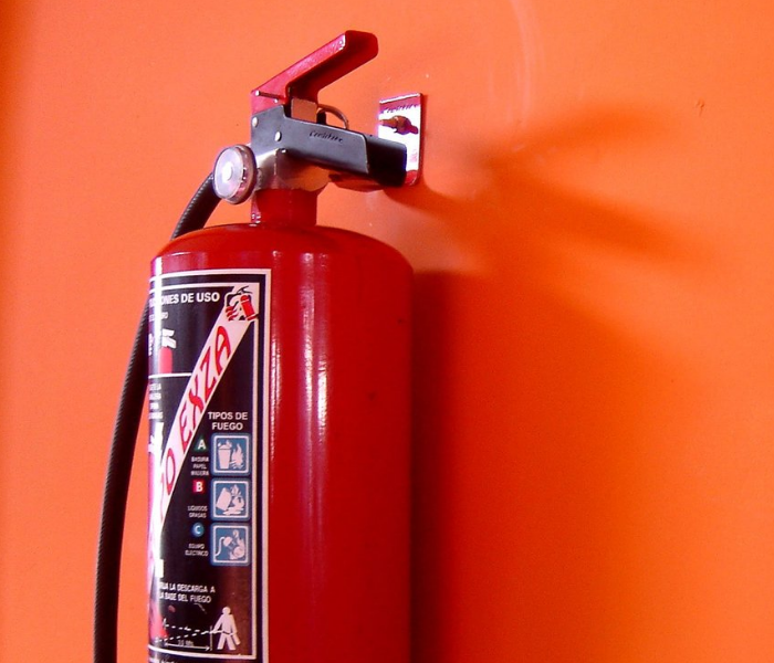 Fire Extinguisher mounted on wall in office